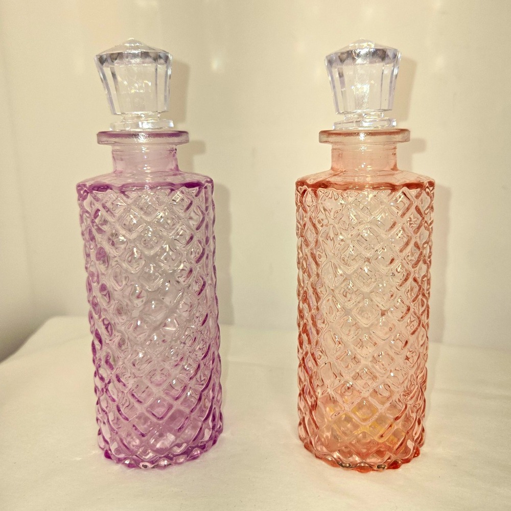 Unmarked Set of 2 Pressed Glass Diamond Bottles w/ Stoppers Pink Purple 7in